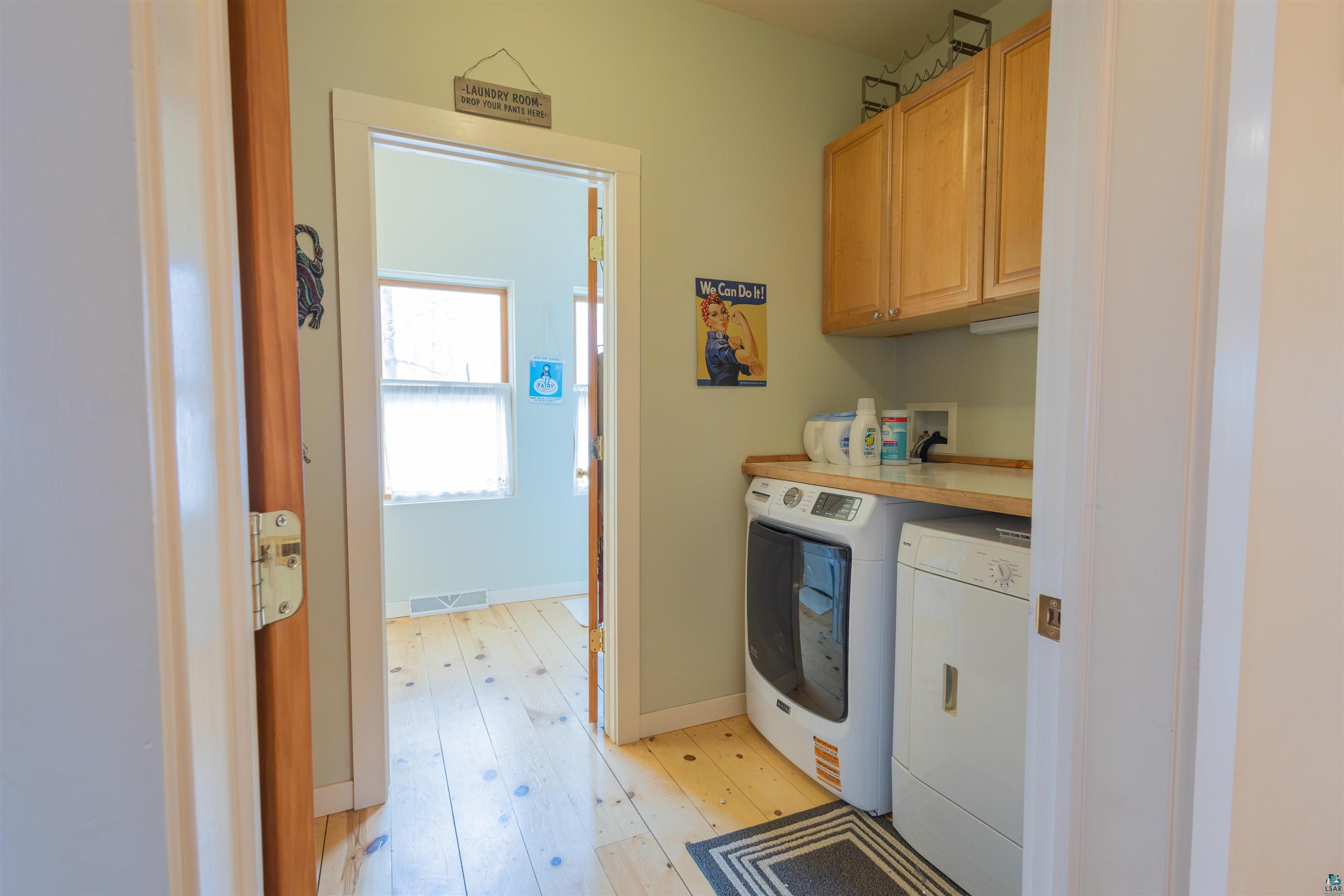 20210 Siskiwit Lake Road Cornucopia, WI 54827 - Photo 15 of 40 Main floor laundry pantry and bath