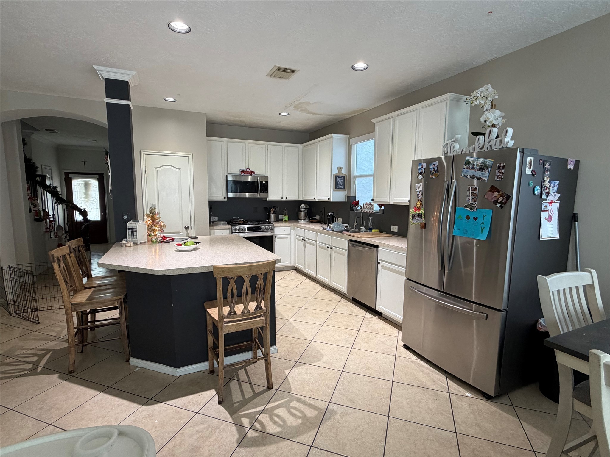 16122 Hidden Crest Drive Houston, TX 77049 - Photo 4 of 8 a kitchen with stainless steel appliances granite countertop a refrigerator and a stove top oven