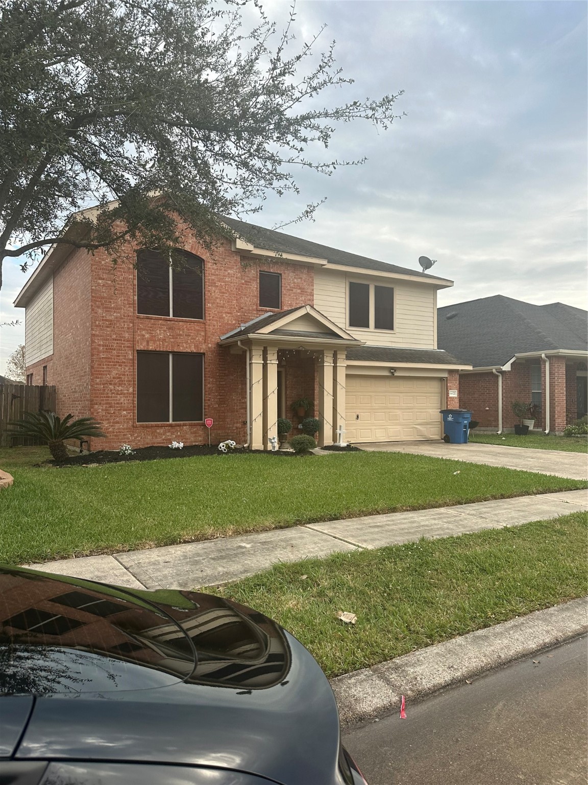 16122 Hidden Crest Drive Houston, TX 77049 - Photo 7 of 8 a front view of a house with a yard
