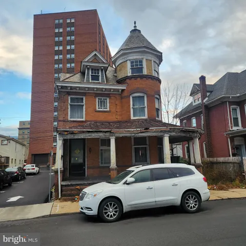 a car parked in front of a house