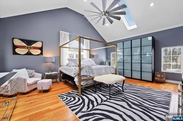 a view of a dining room with furniture and a potted plant