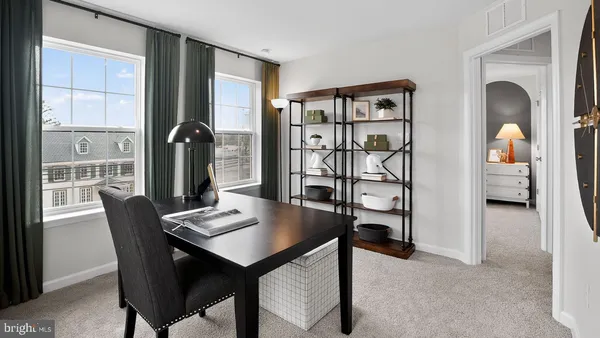 a view of a dining room with furniture and window