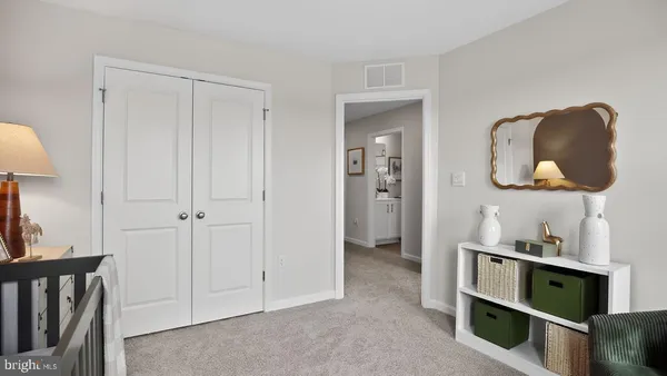 a room with furniture and a mirror