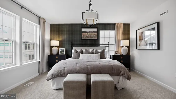 a bed room with a bed and a window