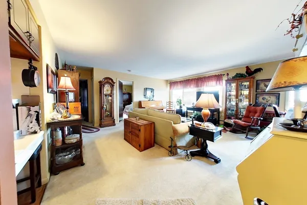a bed room with furniture and a chandelier