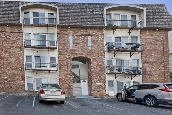 a car parked in front of a brick building
