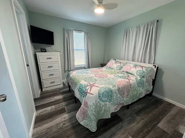 a room with furniture a flat screen tv and a fireplace