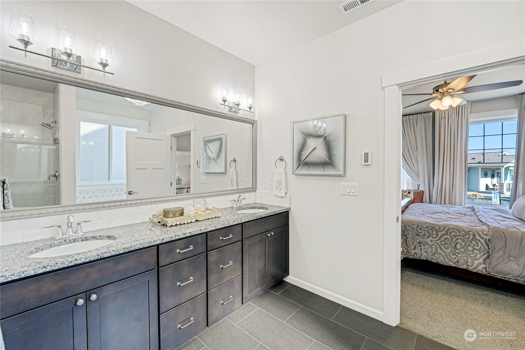 1520 Latitude Circle Anacortes, WA 98221 - Photo 18 of 35 a en suite bathroom with double sink and a mirror