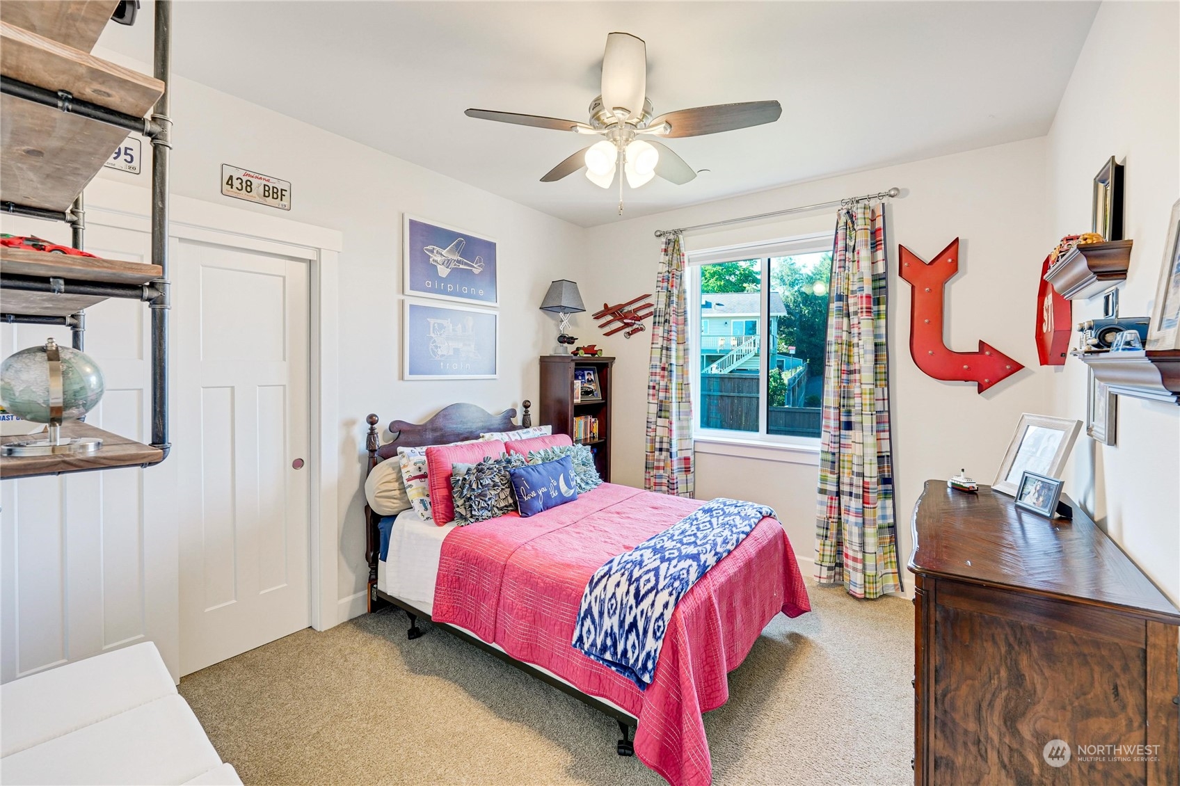 1520 Latitude Circle Anacortes, WA 98221 - Photo 19 of 35 a bedroom with a bed painting on wall and a large window