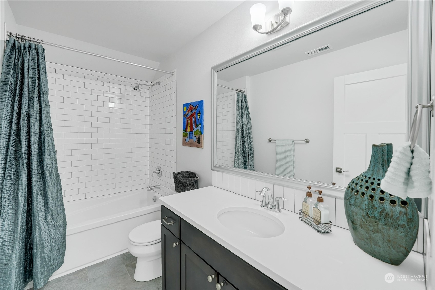 1520 Latitude Circle Anacortes, WA 98221 - Photo 26 of 35 a bathroom with a granite countertop sink and a mirror