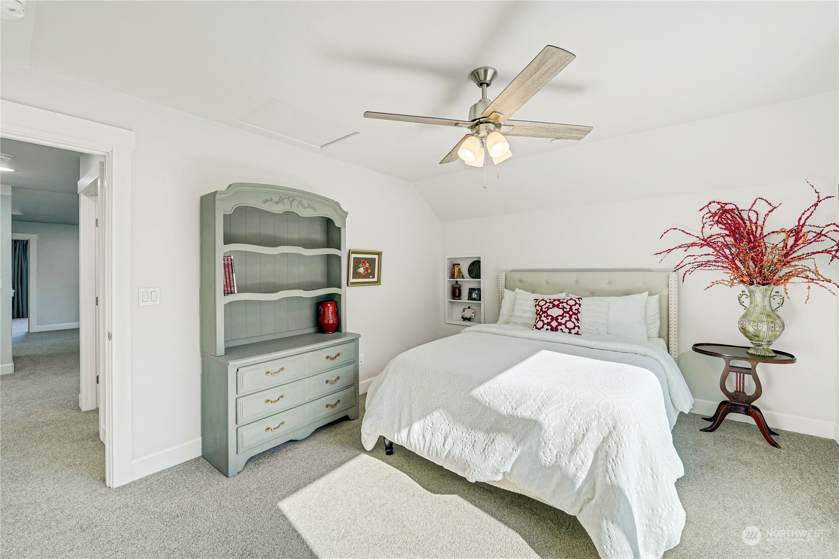 1520 Latitude Circle Anacortes, WA 98221 - Photo 27 of 35 a bedroom with a bed and a chandelier