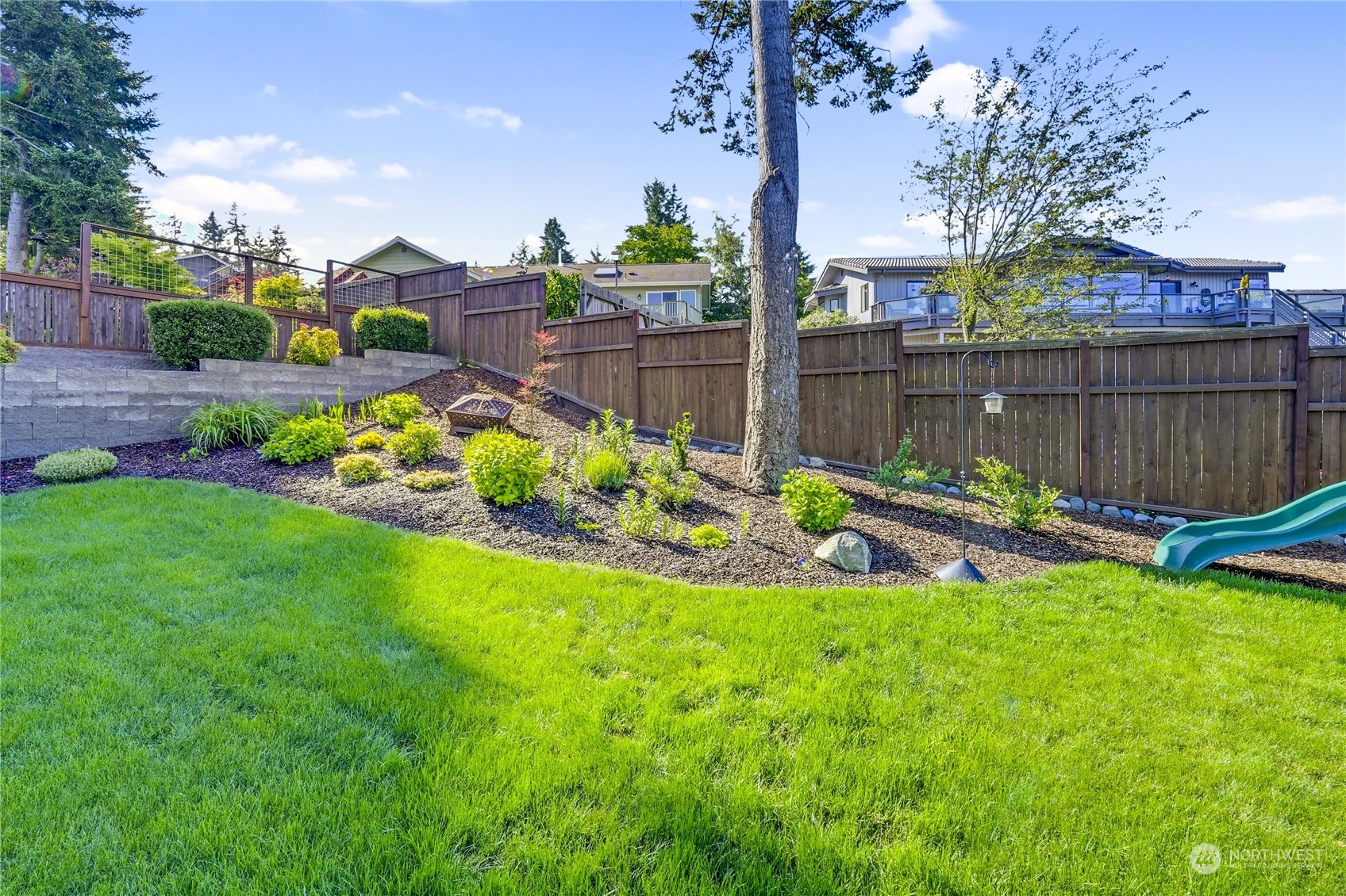 1520 Latitude Circle Anacortes, WA 98221 - Photo 32 of 35 a view of a backyard with a garden and plants