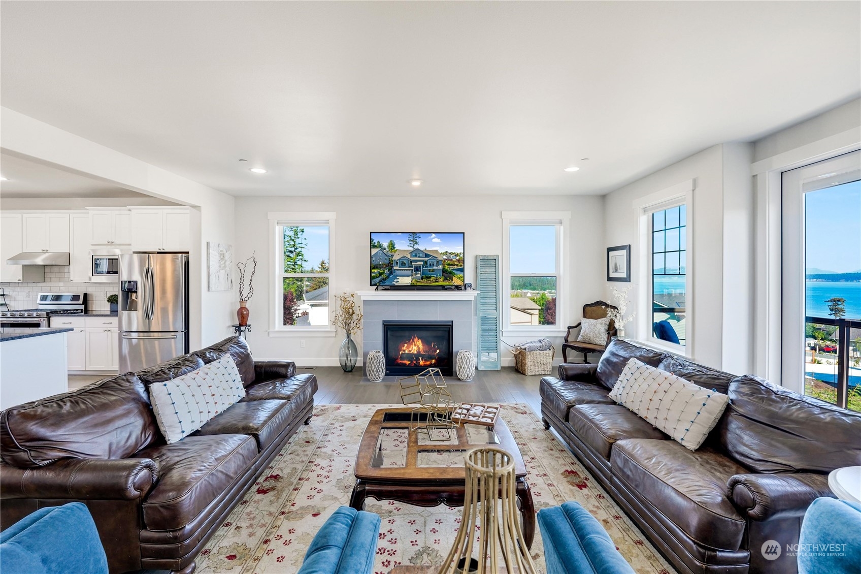 1520 Latitude Circle Anacortes, WA 98221 - Photo 6 of 35 a living room with furniture and a fireplace