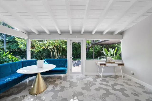 a outdoor space with a table and chairs