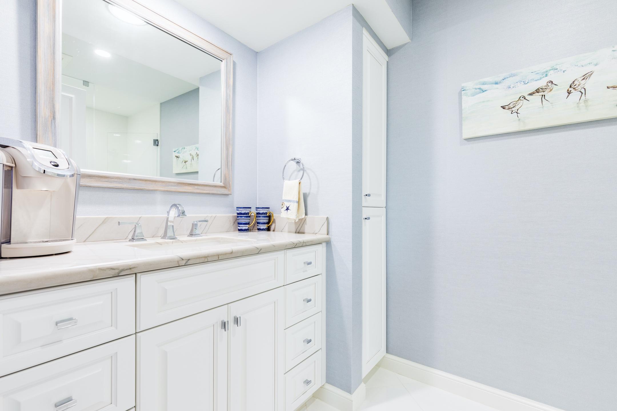 2050 Florida A1A, Unit 3 Jupiter, FL 33477 - Photo 13 of 36 a bathroom with a sink and a mirror