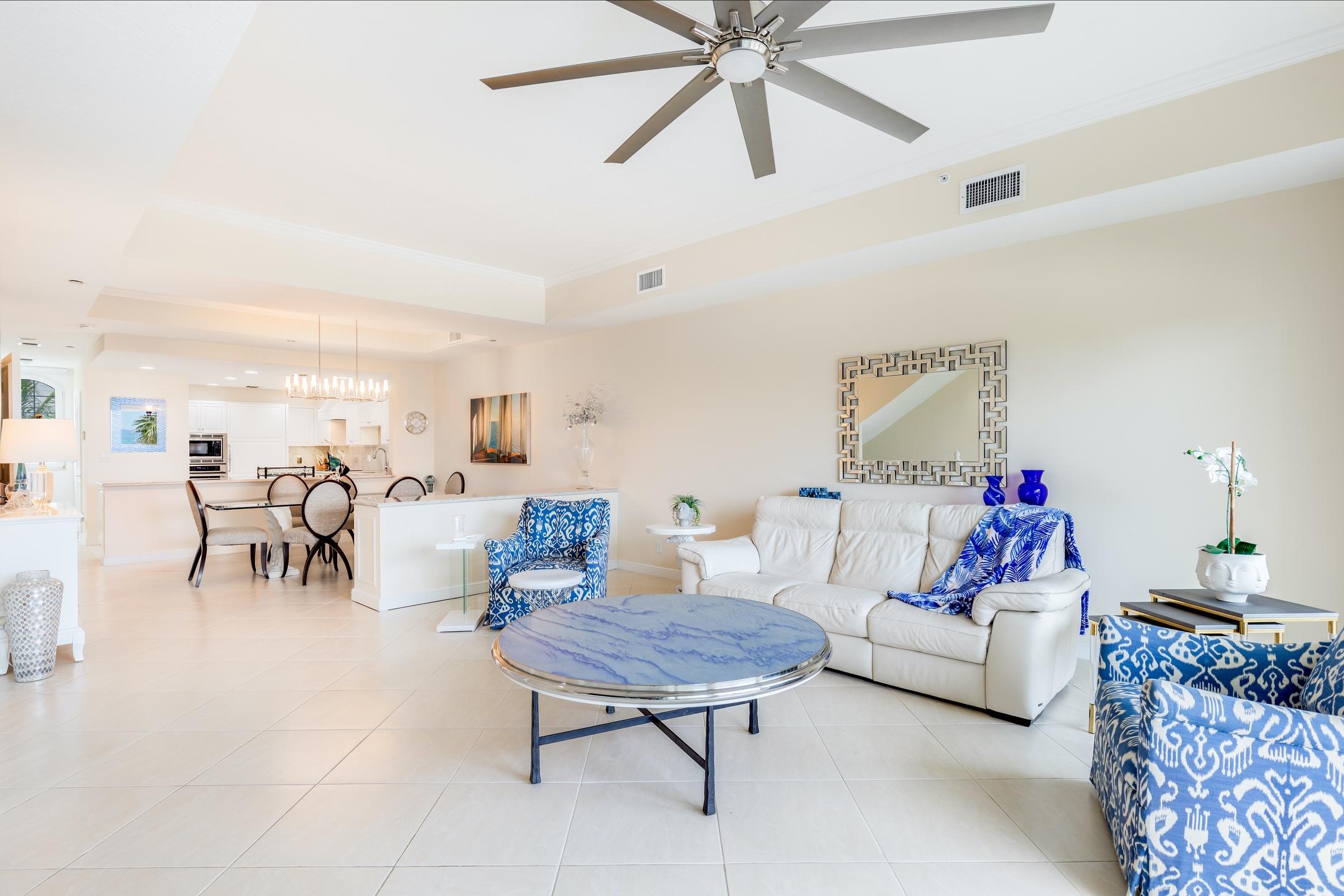 2050 Florida A1A, Unit 3 Jupiter, FL 33477 - Photo 23 of 36 a living room with furniture and a chandelier