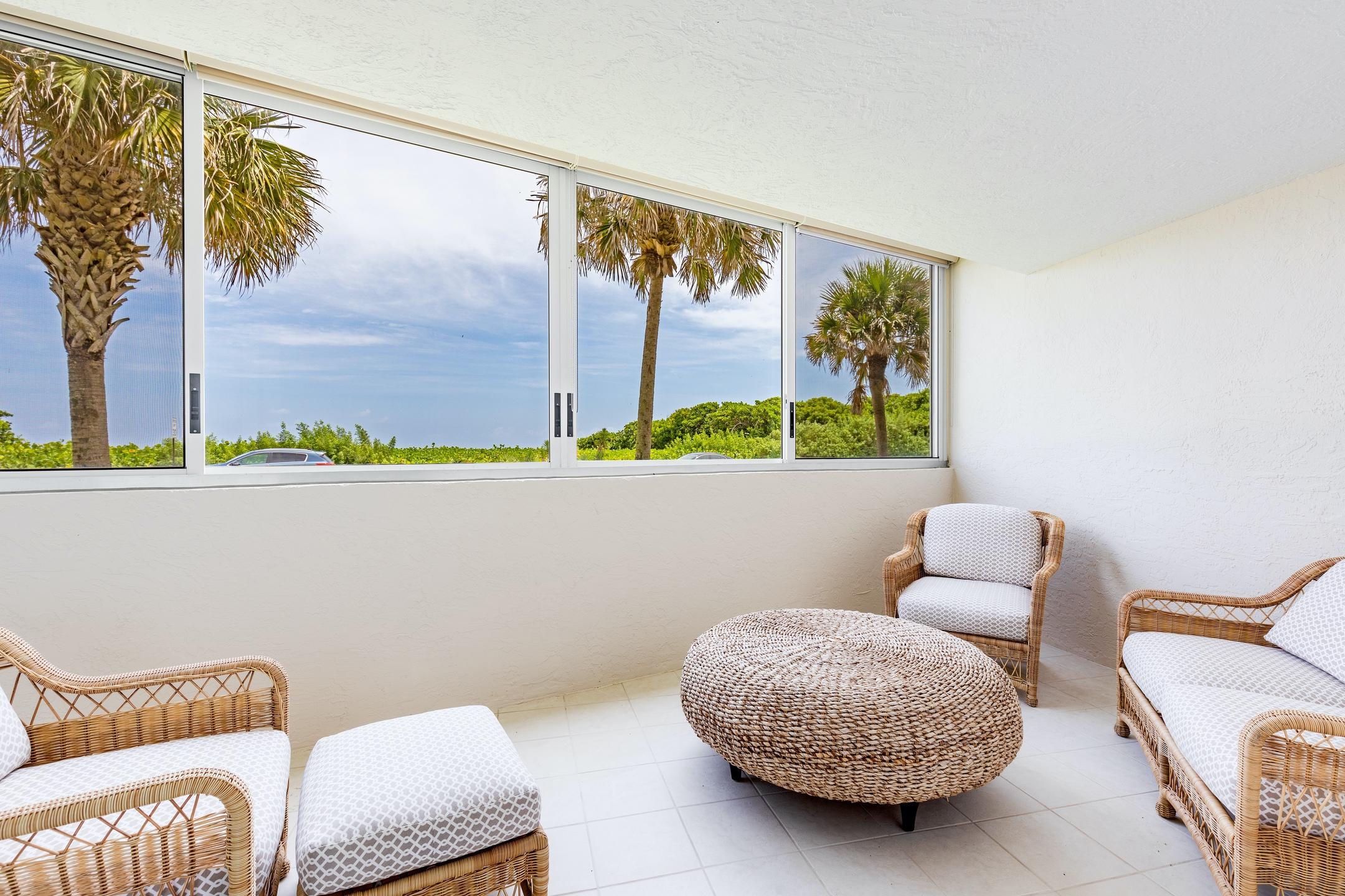 2050 Florida A1A, Unit 3 Jupiter, FL 33477 - Photo 30 of 36 a living room with furniture and a potted plant