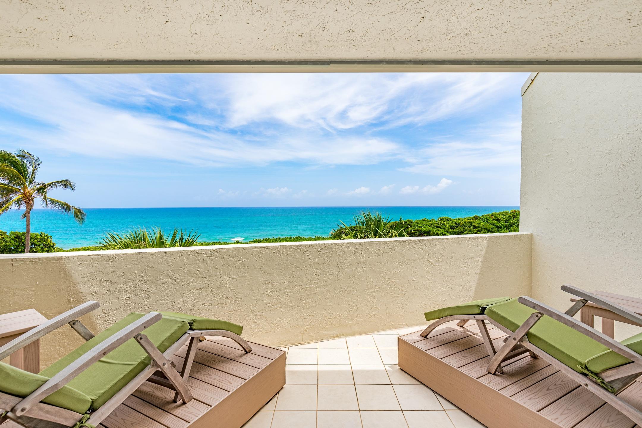 2050 Florida A1A, Unit 3 Jupiter, FL 33477 - Photo 33 of 36 a view of a swimming pool and lounge chair