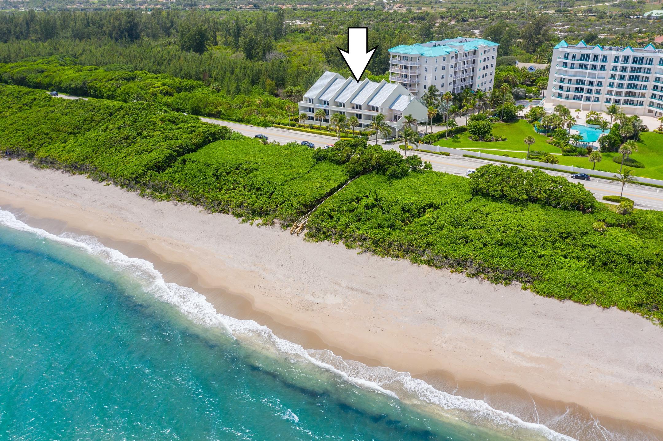 2050 Florida A1A, Unit 3 Jupiter, FL 33477 - Photo 7 of 36 an aerial view of residential houses with outdoor space and street view