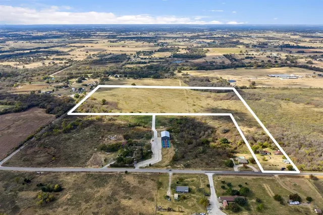 a view of a backyard of a house