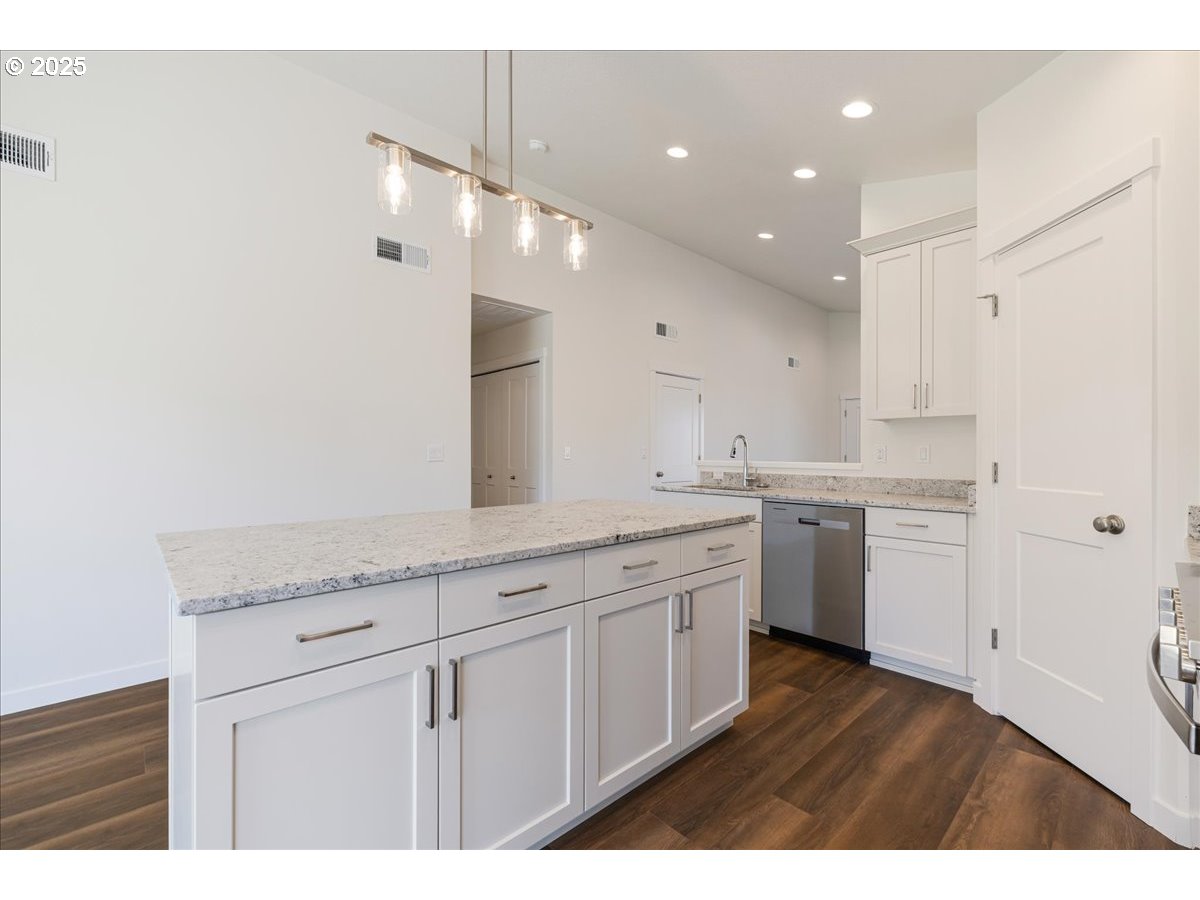 1449 Southeast Hankel Street Dallas, OR 97338 - Photo 6 of 19 a large white kitchen with a sink