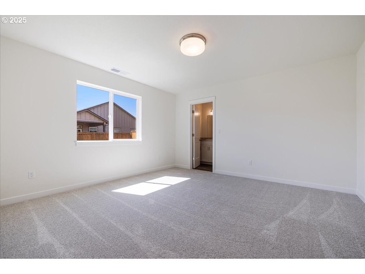 1449 Southeast Hankel Street Dallas, OR 97338 - Photo 9 of 19 a view of an empty room with a window