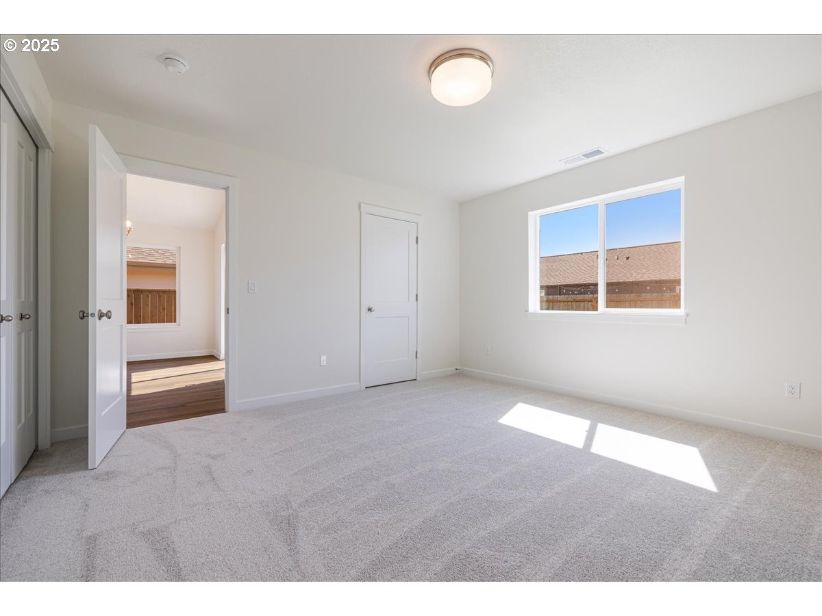 1449 Southeast Hankel Street Dallas, OR 97338 - Photo 10 of 19 a view of an empty room with a window