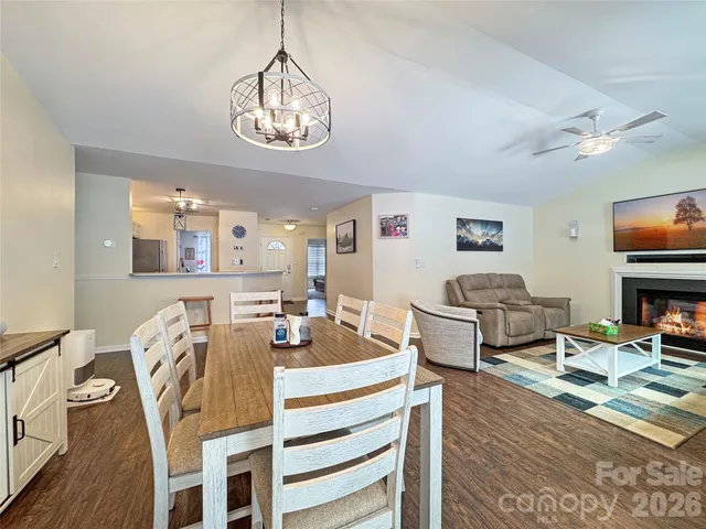 a living room with furniture a rug and a flat screen tv
