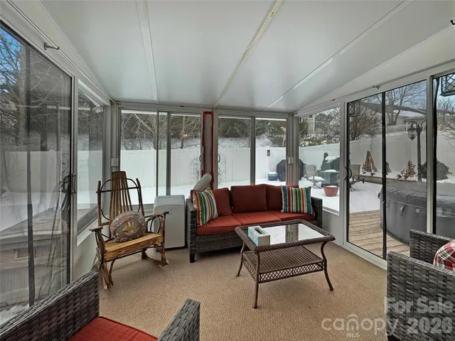 a outdoor living space with furniture and a floor to ceiling window