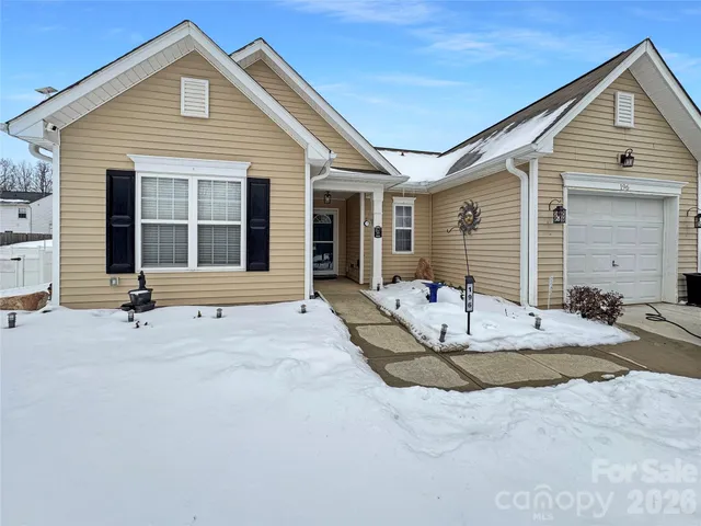 a front view of a house with a sitting area