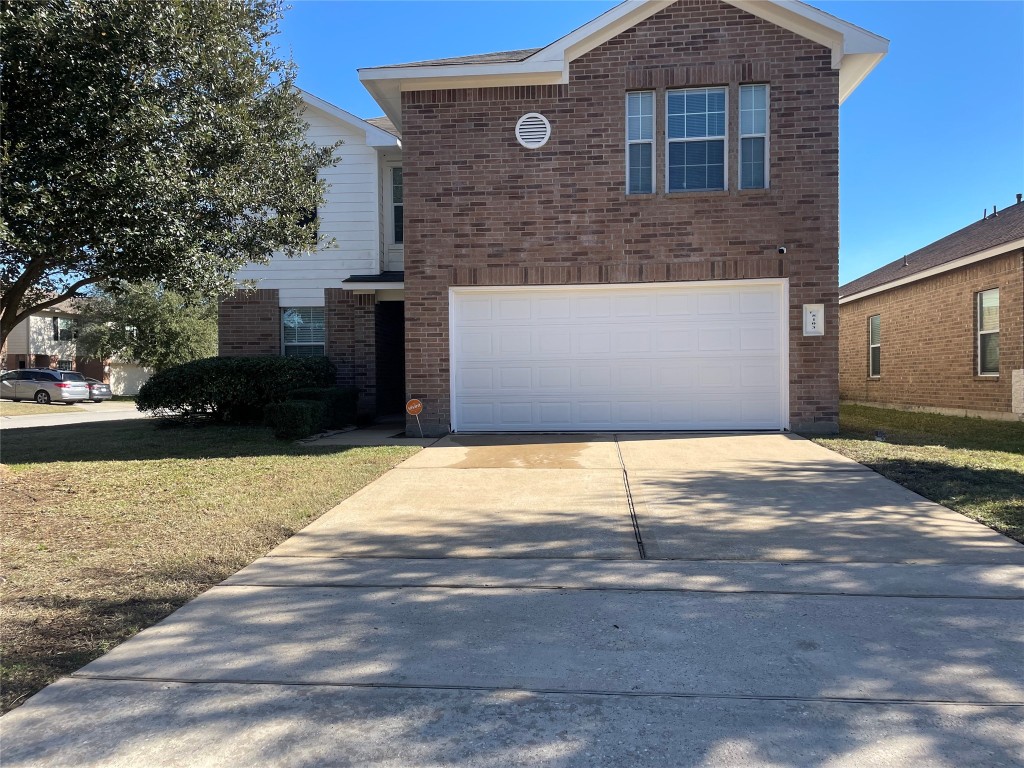 8103 Katie Mill Trail Spring, TX 77379 - Photo 1 of 36 a front view of a house with a yard