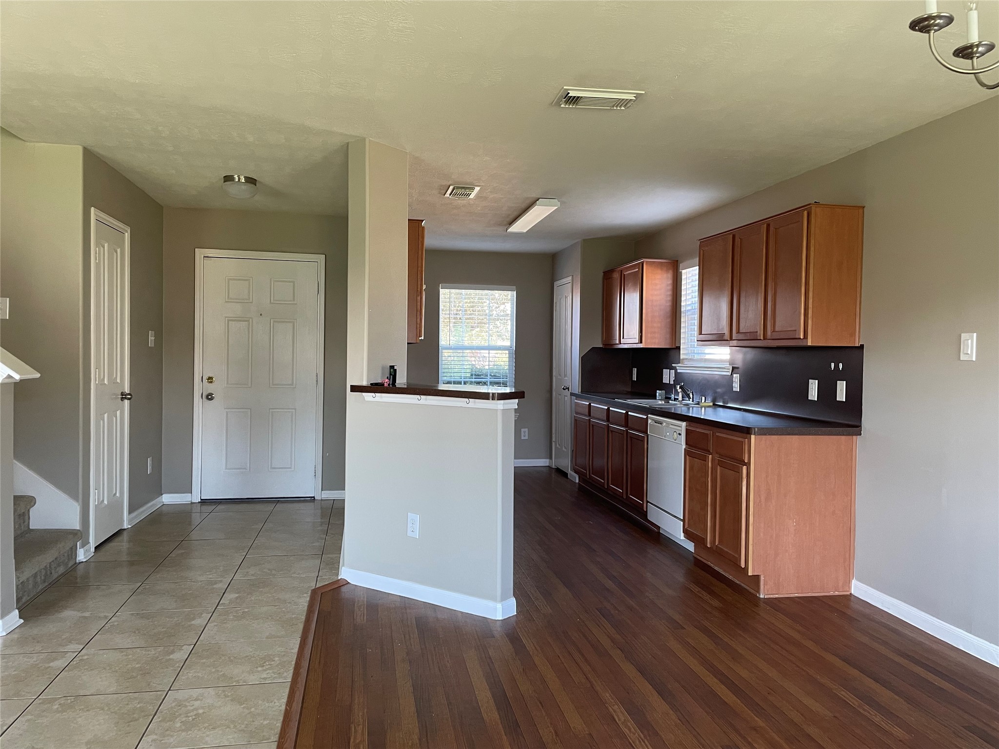 8103 Katie Mill Trail Spring, TX 77379 - Photo 15 of 36 a kitchen with granite countertop a refrigerator and a stove top oven