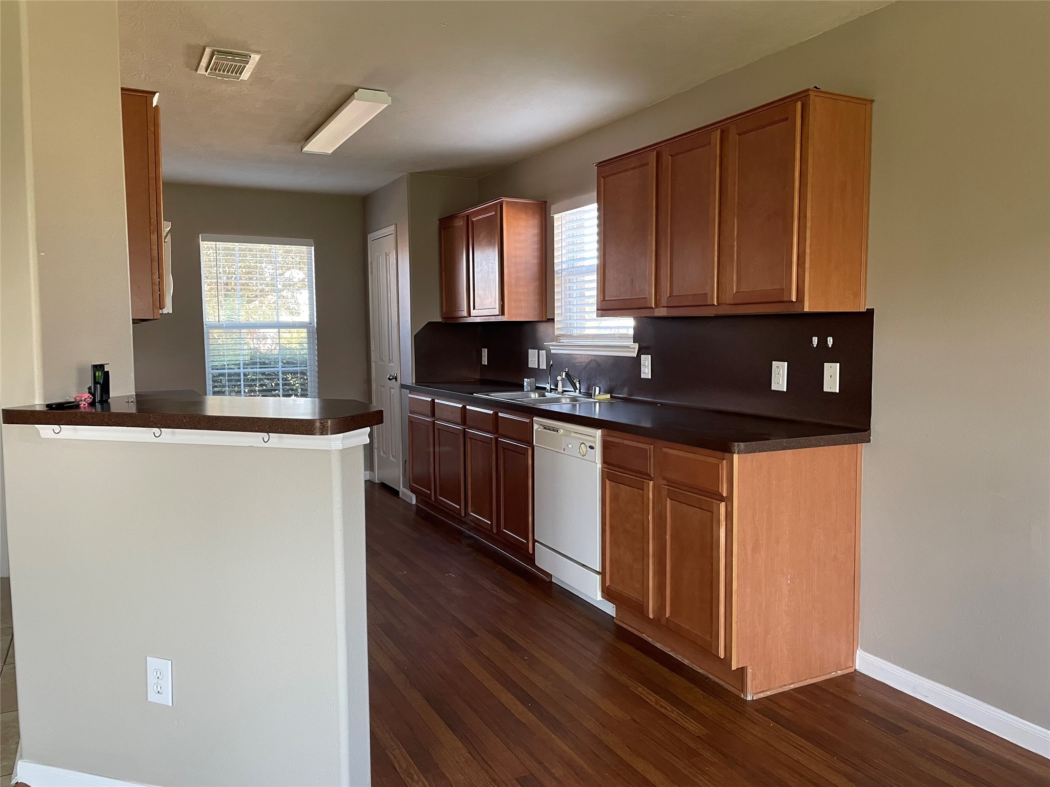 8103 Katie Mill Trail Spring, TX 77379 - Photo 18 of 36 a kitchen with stainless steel appliances granite countertop a stove a sink and a microwave