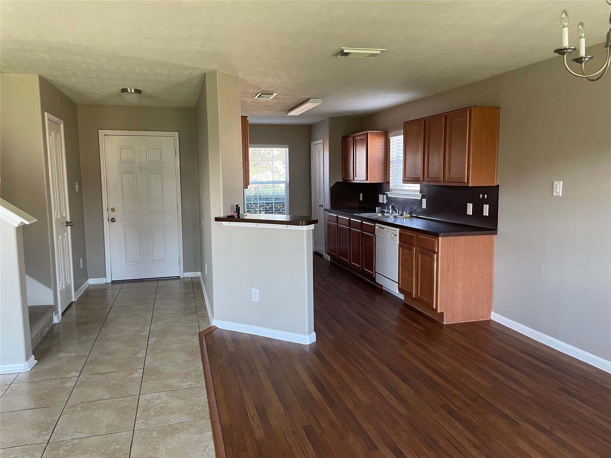 8103 Katie Mill Trail Spring, TX 77379 - Photo 19 of 36 a kitchen with stainless steel appliances granite countertop a stove a sink and a refrigerator