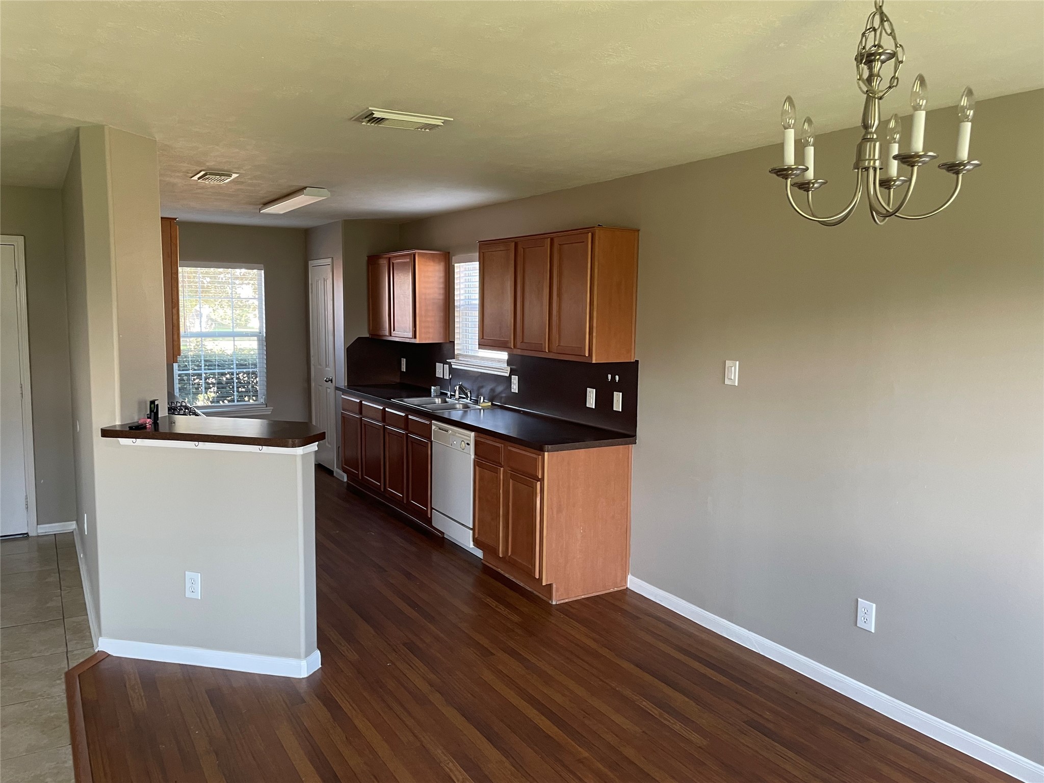 8103 Katie Mill Trail Spring, TX 77379 - Photo 22 of 36 a kitchen with granite countertop a stove and a wooden floors