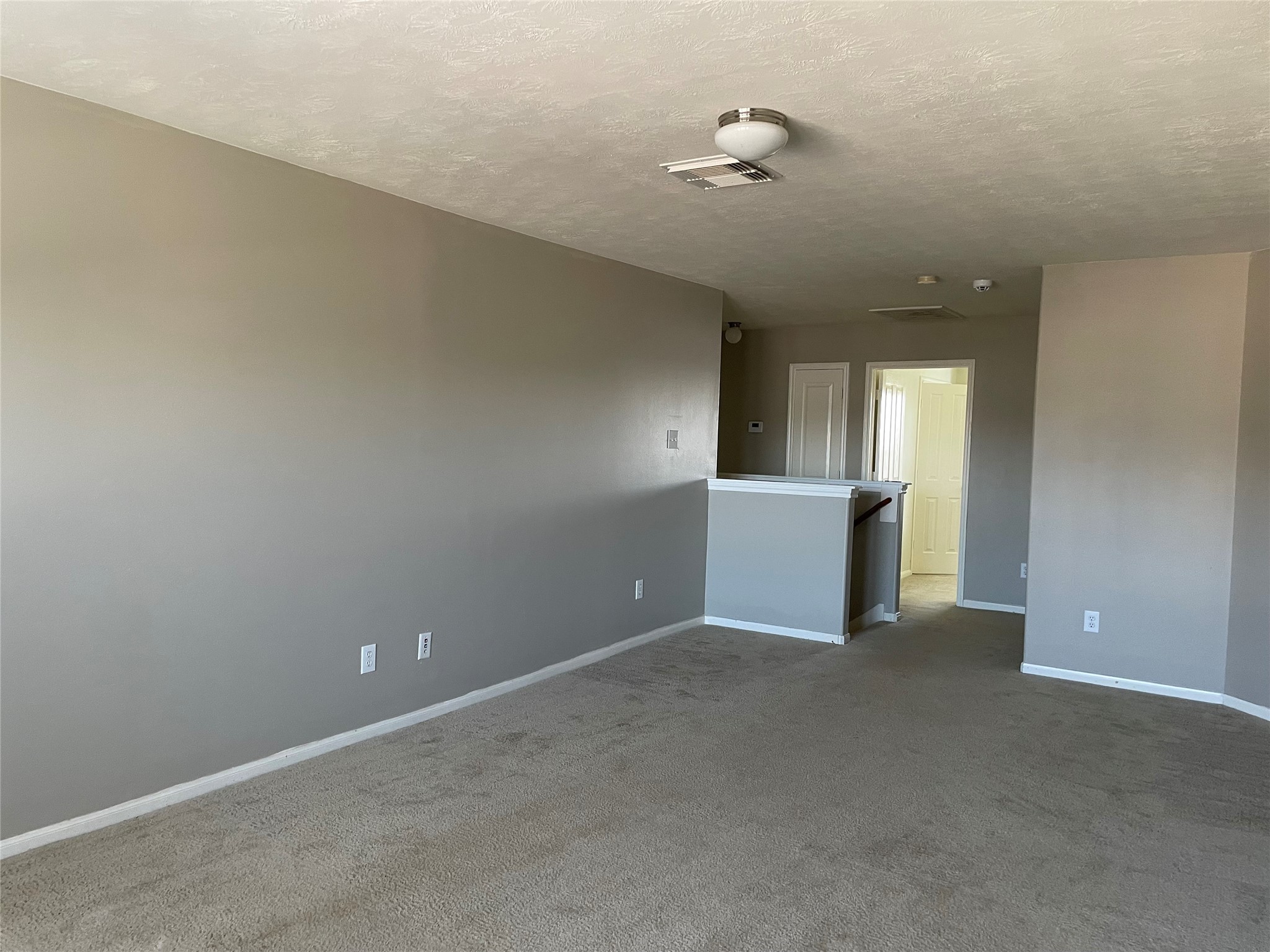 8103 Katie Mill Trail Spring, TX 77379 - Photo 26 of 36 a view of an empty room with a chandelier fan