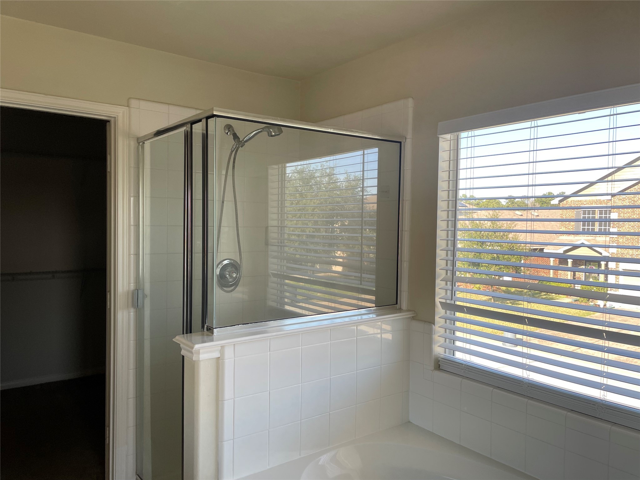 8103 Katie Mill Trail Spring, TX 77379 - Photo 29 of 36 a bathroom with a shower and a window