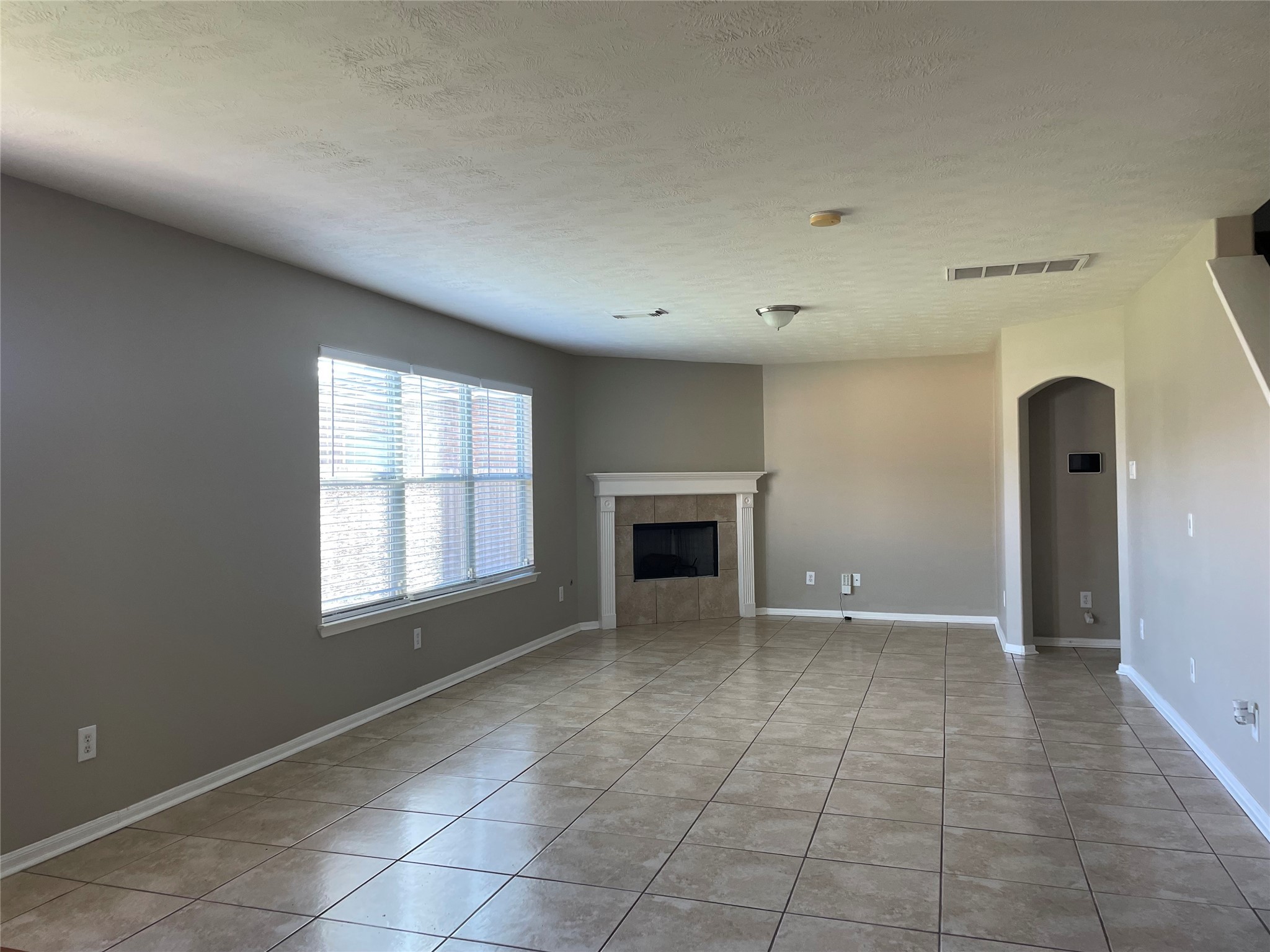 8103 Katie Mill Trail Spring, TX 77379 - Photo 6 of 36 a view of an empty room with a fireplace and a window