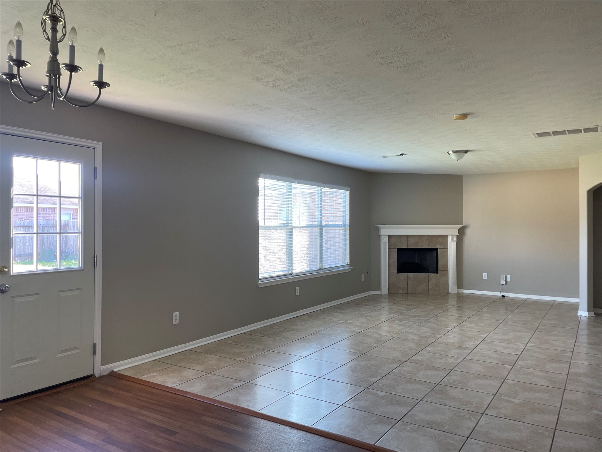 8103 Katie Mill Trail Spring, TX 77379 - Photo 7 of 36 an empty room with windows and fireplace
