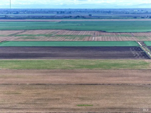 a view of a chair and table in the patio