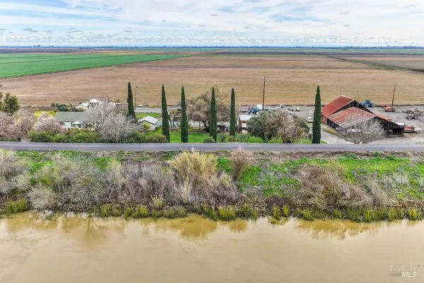 a view of a house with a patio and entertaining space