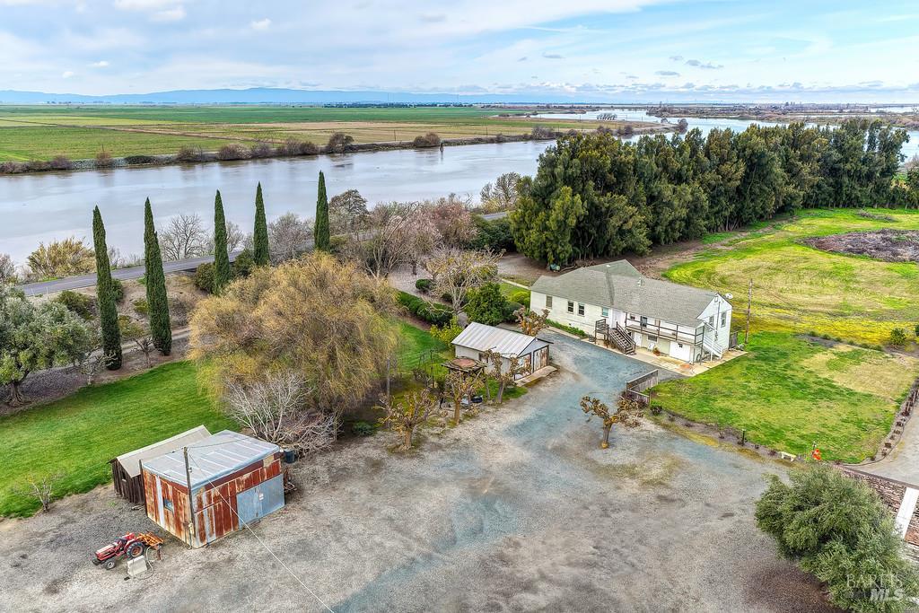 3834 Highway 84 Walnut Grove, CA 95690 - Photo 34 of 84 a yard with pier lake view and houses in the back
