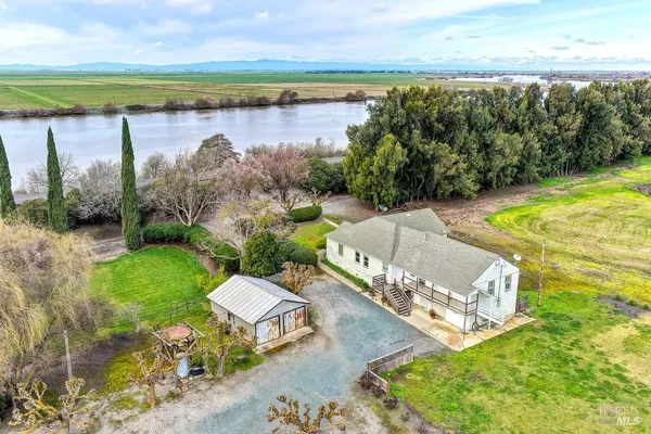 a view of living room with furniture and wooden floor