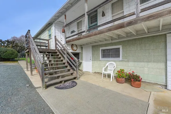 a bathroom with a toilet a sink and a window