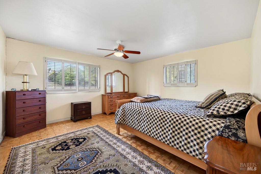 3834 Highway 84 Walnut Grove, CA 95690 - Photo 73 of 84 a bedroom with a large bed and a window
