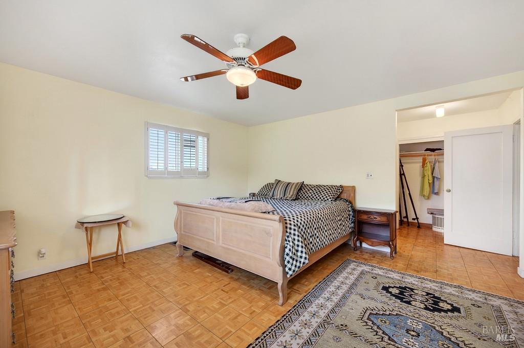 3834 Highway 84 Walnut Grove, CA 95690 - Photo 74 of 84 a living room with a bed and dresser next to a window