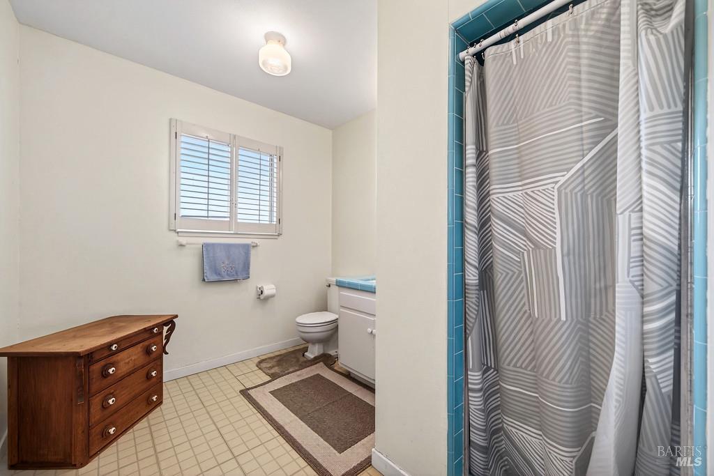 3834 Highway 84 Walnut Grove, CA 95690 - Photo 76 of 84 a bathroom with a toilet a sink and a window