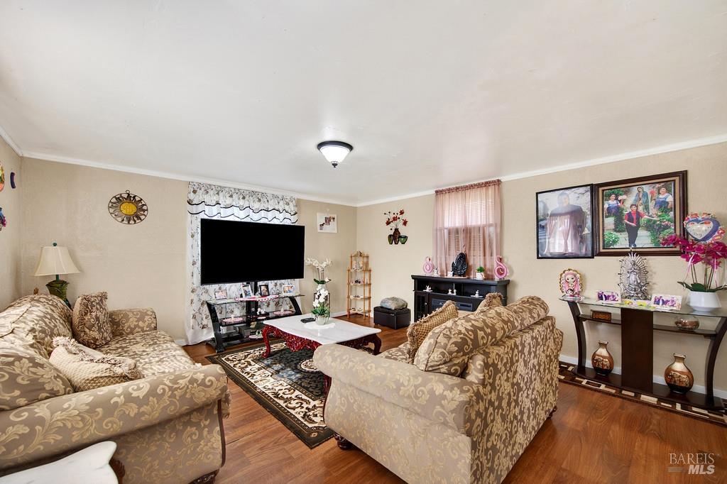 3834 Highway 84 Walnut Grove, CA 95690 - Photo 77 of 84 a living room with furniture and a flat screen tv