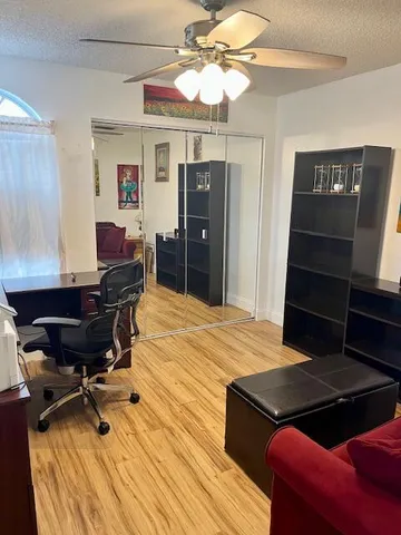 a bed room with a bed and a chair