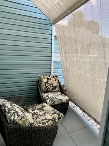 a bedroom with bed and a window